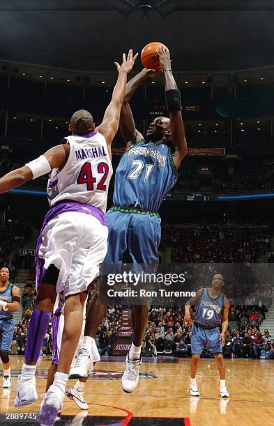 Kevin Garnett of the Minnesota Timberwolves takes the fadeaway jumper over Donyell Marshall of the Toronto Raptors January 21, 2004 at the Air Canada...