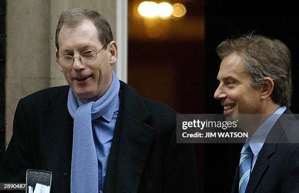 British Prime Minister Tony Blair departs No. 10 Downing Street with his official spokesman Tom Kelly 22 January 2004 after the weekly cabinet...