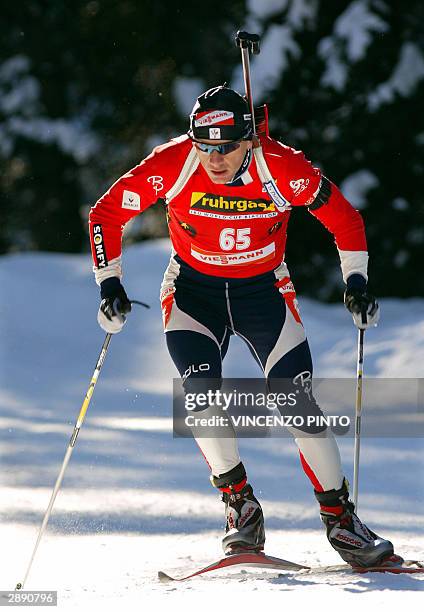 French Raphael Poiree skies during the men biathlon 20 km individual event part of the Biathlon World Cup in Anterselva 22 January 2004. German Sven...