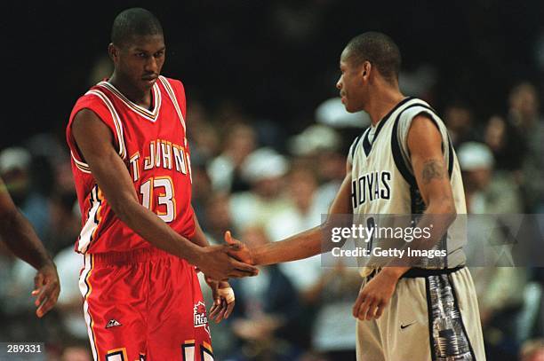 FELIPE LOPEZ OF THE ST. JOHN''S REDMEN SHAKES HANDS WITH GEORGETOWN''S ALLEN IVERSON PRIOR TO THE BIG-EAST CONFERENCE GAME AT THE US AIR ARENA