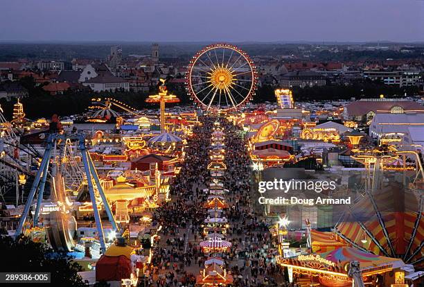 germany,munich,view across crowded beer fest at night - oktoberfest germany stock pictures, royalty-free photos & images