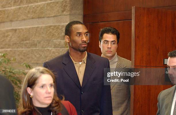 Los Angeles Lakers star Kobe Bryant enters the courtroom accompanied by his attorney Pamela Mackey at the Eagle County Justice Center January 23,...