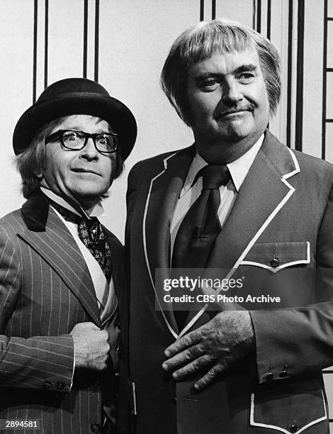 Comedian guest Arte Johnson poses with American children's television host Robert Keeshan on the set of the TV series, 'Captain Kangaroo,' 1975.