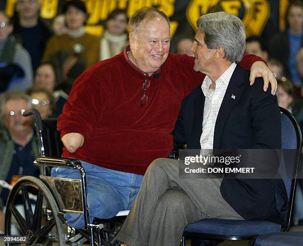 Former US senator from Georgia and Vietnam veteran Max Cleland embraces Democratic presidential hopeful US Senator John Kerry of Massachusetts during...