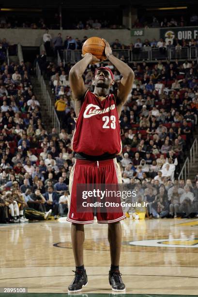 LeBron James of the Cleveland Cavaliers shoots a free throw against the Seattle Sonics during the game at Key Arena on January 13, 2004 in Seattle,...