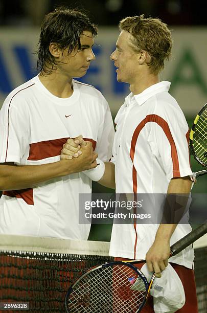 Lleyton Hewitt of Australia is congratulated by Rafael Nadal of Spain during day six of the Australian Open Grand Slam at Melbourne Park January 24,...