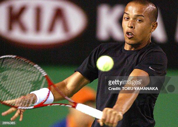 Hicham Arazi of Morocco hits a return against Albert Costa of Spain in their men's singles third round match at the Australian Open in Melbourne, 24...