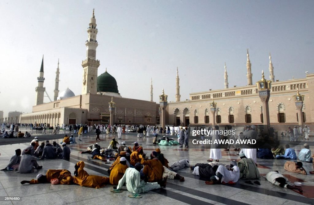 Muslim pilgrims gather outside the Proph