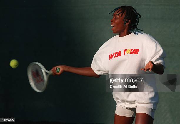 VENUS WILLIAMS AGED 14, IN ACTION DURING A YOUTH TENNIS CLINIC AT THE EL MONT TENNIS CENTER IN OAKLAND, CALIFORNIA. WILLIAMS MAKES HER PROFFESSIONAL...
