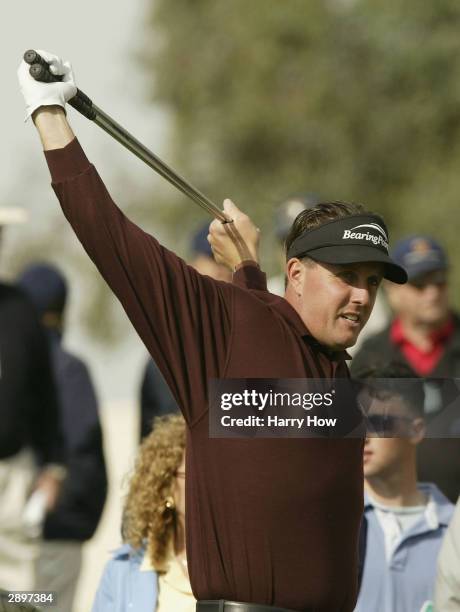 Phil Mickelson stretches on the third tee during the fourth round of the Bob Hope Chrysler Classic on January 24, 2004 at the Bermuda Dunes Country...