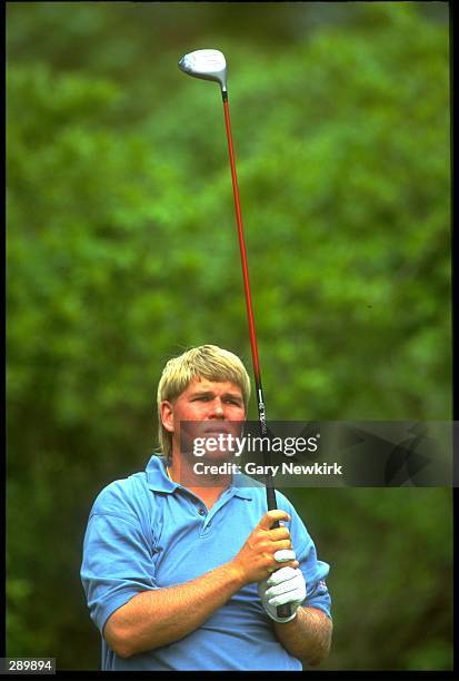 JOHN DALY WATCHES HIS TEE SHOT FLY DURING THE 1993 PLAYERS CHAMPIONSHIP AT TPC SAWGRASS IN PONTE VEDRA, FLORIDA.