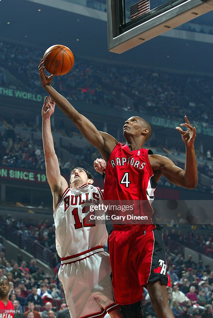 Bosh Raptors Chris Bosh of the Toronto Raptors grabs a rebound from Kirk Hinrich ...