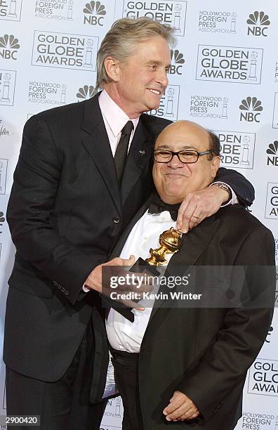 Winner of the Cecil B. DeMille Award Actor Michael Douglas and Actor/Director Danny DeVito pose backstage at the 61st Annual Golden Globe Awards at...