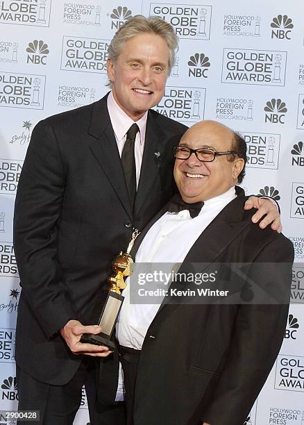 Winner of the Cecil B. DeMille Award Actor Michael Douglas and Actor/Director Danny DeVito pose backstage at the 61st Annual Golden Globe Awards at...
