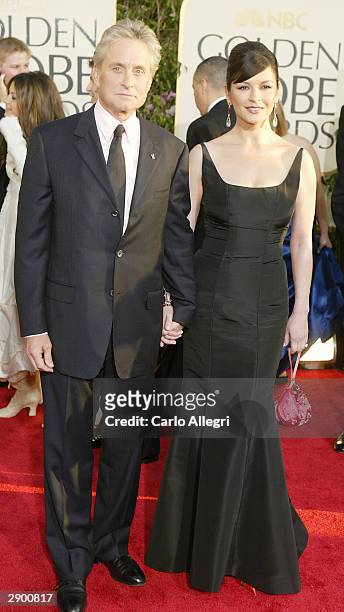 Actors Michael Douglas and wife Catherine Zeta-Jones attend the 61st Annual Golden Globe Awards at the Beverly Hilton Hotel on January 25, 2004 in...