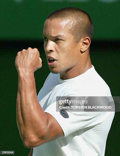 Hicham Arazi of Morroco pumps his fist to celebrate a point against Mark Philippoussis of Australia in their men's singles fourth round match at the...