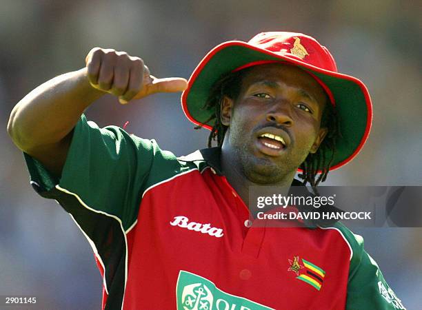 Zimbabwe all-rounder Douglas Hondo is jubilant after the fall of Australia's Michael Bevan during the tri nations one day international Australia v...