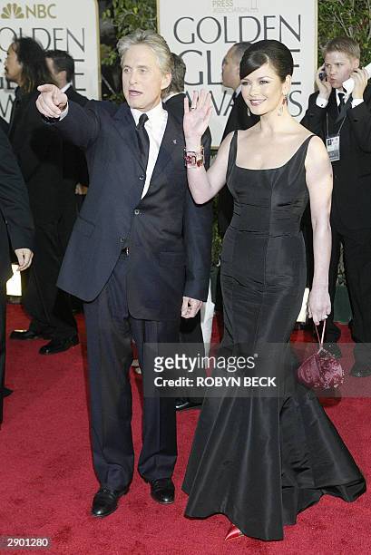 Michael Douglas and wife Catherine Zeta-Jones arrive for the 61st Golden Globe awards in Beverly Hills, California, 25 January 2004. AFP PHOTO /...