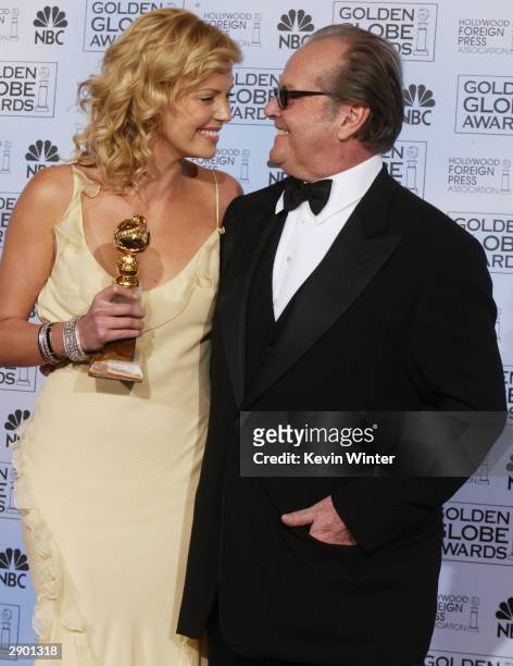 Winner for Best Performance by an Actress in a Motion Picture Drama Charlize Theron and Actor Jack Nicholson pose backstage at the 61st Annual Golden...