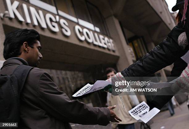 Students at King's College in Central London hand out fliers 26 January 2004 calling for a demonstration against top-up fees to be held 27 January...