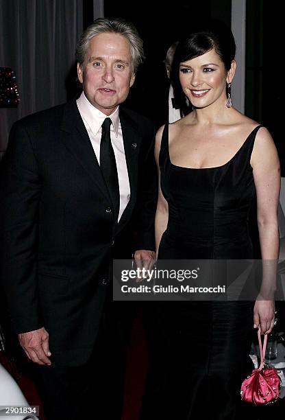 Michael Douglas and Catherine Zeta-Jones attend NBC's Access Hollywood Golden Globe Party, January 25, 2004 in Hollywood, California.