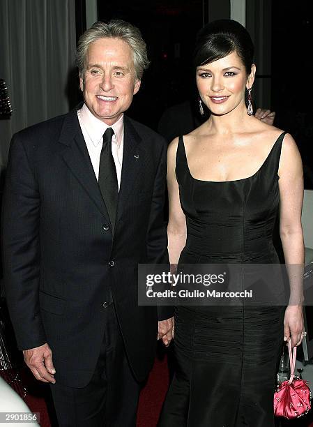 Michael Douglas and Catherine Zeta-Jones attend NBC's Access Hollywood Golden Globe Party, January 25, 2004 in Hollywood, California.