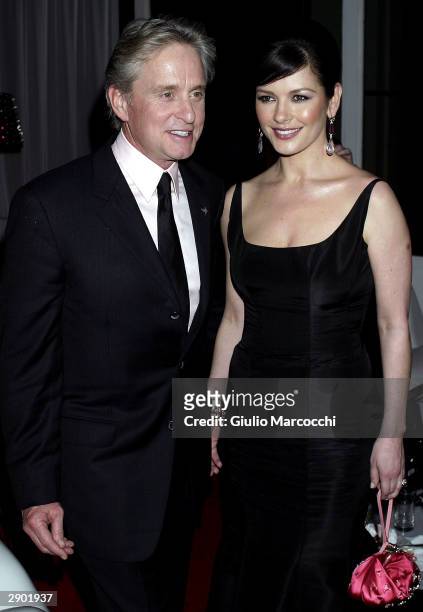 Michael Douglas and Catherine Zeta-Jones attend NBC's Access Hollywood Golden Globe Party, January 25, 2004 in Hollywood, California.