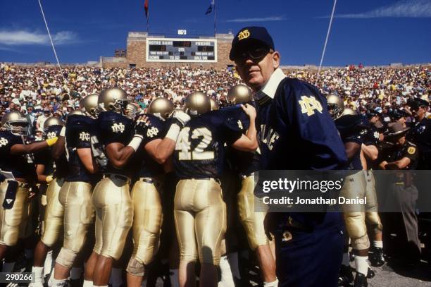 Head coach Lou Holtz of the University of Notre Dame leads his team onto the field prior to the Fighting Irish 52-7 win over Purdue at Notre Dame...