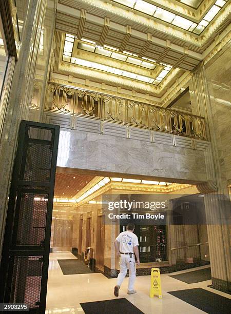 Worker walks through an Art Deco-era entrance to the new Hard Rock Hotel January 26, 2004 in Chicago, Illinois. Hard Rock Cafe International has...