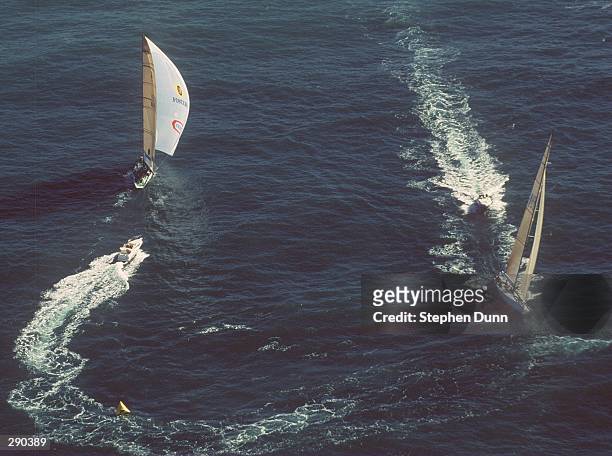 ONEAUSTRALIA, AUS 31, LEFT, FLIES ITS SPINAKER AFTER ROUNDING THE FIRST MARK OFFICIALLY ONE MINUTE TWO SECONDS AHEAD OF SYDNEY 95, AUS 29, IN THEIR...