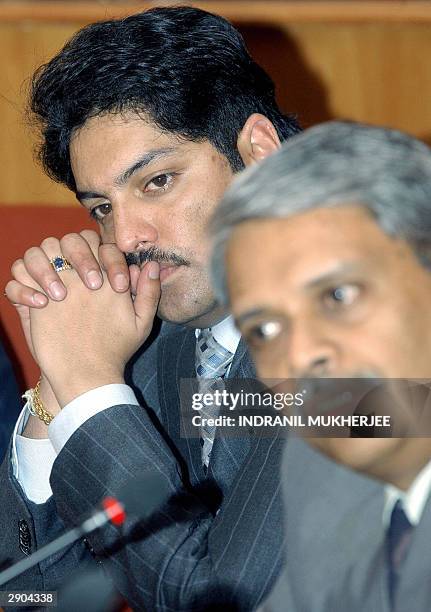 Nepalese Crown Prince Paras Bir Bikram Shah Dev listens to Chief Operating Officer of India's second largest software exporter Infosys Technologies...