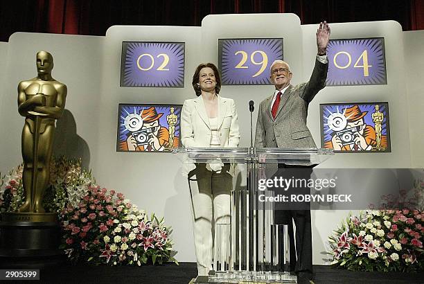 Actress Sigourney Weaver and Academy of Motion Picture Arts and Sciences President Frank Pierson wave goodbye at the end of the annoucement of...