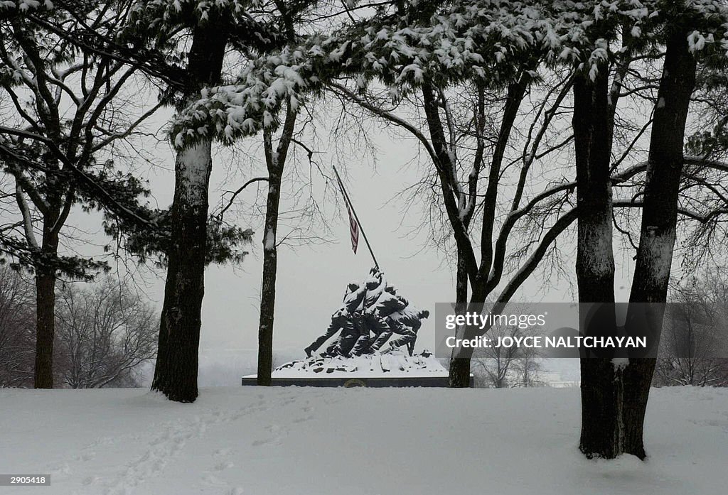 The Iwo Jima Memorial, stands covered wi