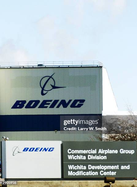 Boeing Co. Signs are seen at the company's plant January 27, 2004 in Wichita, Kansas. After weekend reports in the Seattle Times said Boeing was...