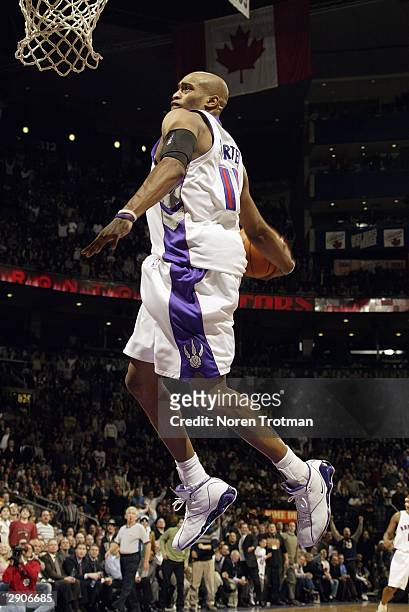 Vince Carter of the Toronto Raptors goes in for the dunk against the Cleveland Cavaliers during the game at Air Canada Centre on January 7, 2004 in...
