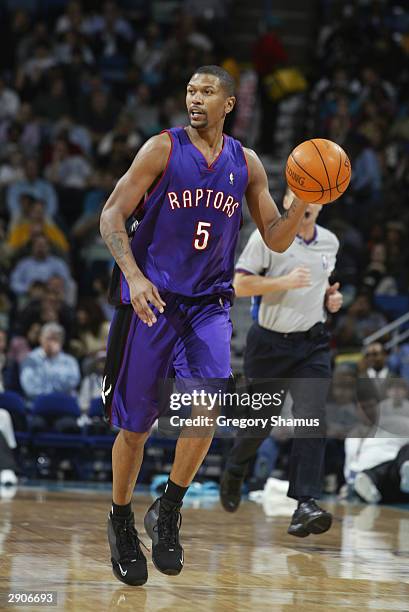 Jalen Rose of the Toronto Raptors moves the ball during the game against the New Orleans Hornets at the New Orleans Arena on January 15, 2004 in New...