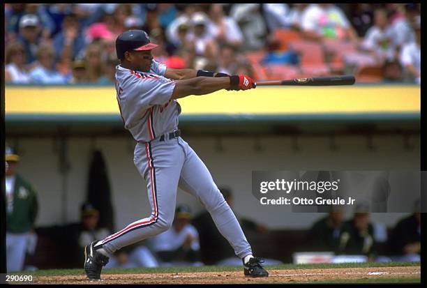 CLEVELAND INDIANS LEFT FIELDER ALBERT BELLE TAKES A SWING AGAINST THE OAKLAND A''S AT THE OAKLAND COUNTY STADIUM IN OAKLAND, CALIFORNIA.