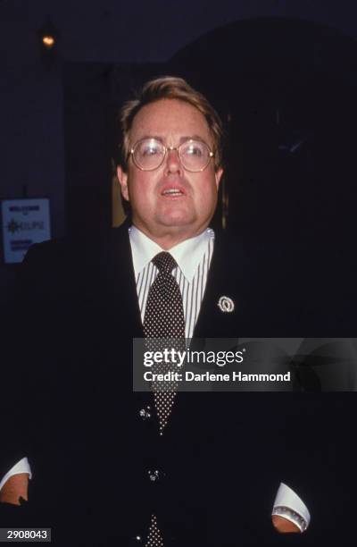 Portrait of American producer Allan Carr wearing a suit and tie, circa 1990s. Carr produced the film 'Grease' in 1978.