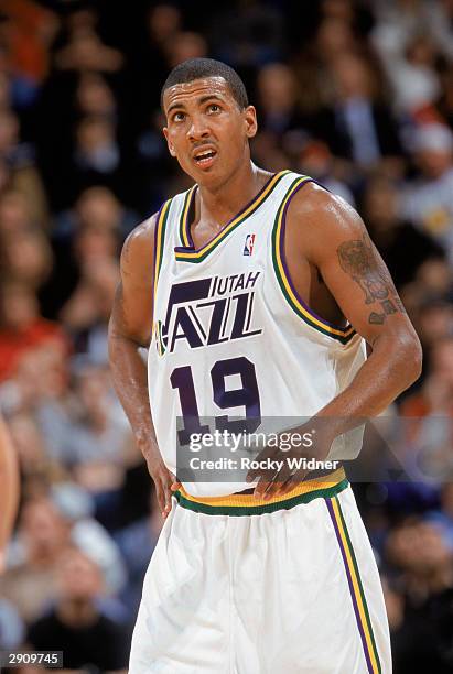 Raja Bell of the Utah Jazz checks the scoreboard during the NBA game against the Golden State Warriors at The Arena in Oakland on January 19, 2003 in...