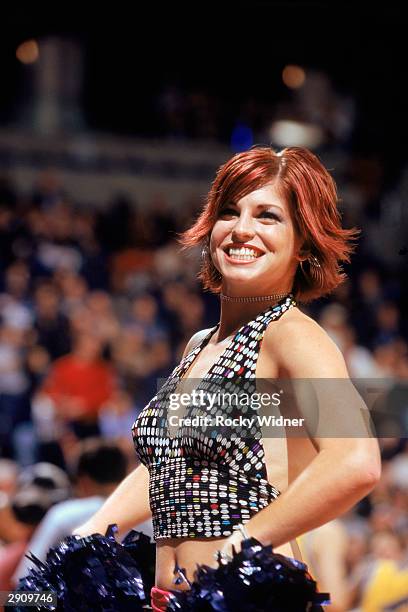 Dancer preforms her routine during the NBA game between the Utah Jazz and the Golden State Warriors at The Arena in Oakland on January 19, 2003 in...