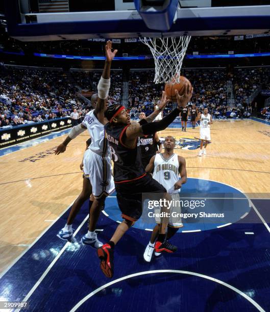 Allen Iverson of the Philadelphia 76ers goes for a layup during the NBA game against the New Orleans Hornets at New Orleans Arena on January 21, 2004...