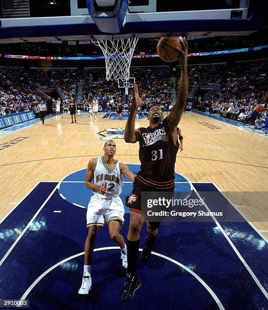 Glenn Robinson of the Philadelphia 76ers goes for a layup during the NBA game against the New Orleans Hornets at New Orleans Arena on January 21,...