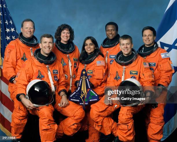 The crew of Space Shuttle Columbia's mission STS-107 take a break from their training regime to pose for the traditional crew portrait. Seated in...