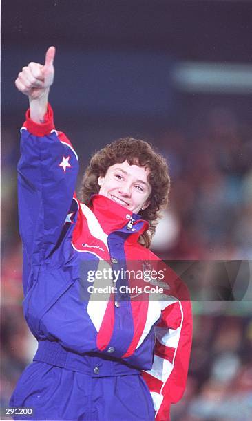 USA SPEEDSKATER BONNIE BLAIR GIVES A THUMBS UP AS SHE ACCEPTS THE GOLD MEDAL FOR WINNING THE 1000 METER RACE AT THE 1994 WINTER OLYMPICS IN...