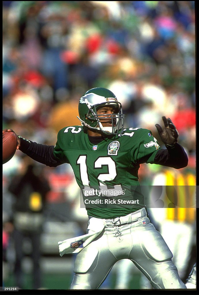 RANDALL CUNNINGHAM QUARTERBACK FOR THE PHILADELPHIA EAGLES FIRES A randall-cunningham-quarterback-for-the-philadelphia-eagles-fires-a