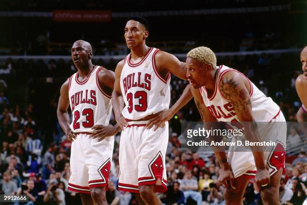 Michael Jordan, Scottie Pippen and Dennis Rodman the Chicago Bulls look on during a break in game action during the NBA Eastern Conference Finals...