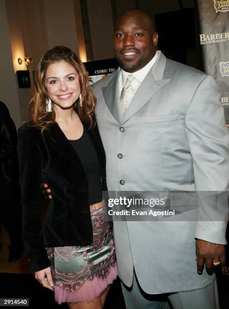 Football player Warren Sapp and reporter Maria Menounes attend the "Barbershop 2: Back In Business" special screening at the Angelika Film Center...