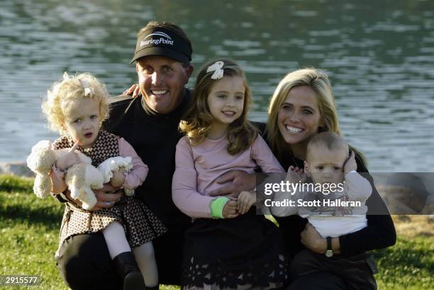 Phil Mickelson celebrates his win as he poses for a portrait with his wife Amy and their three children two-year old Sophia Isabel, four-year old...