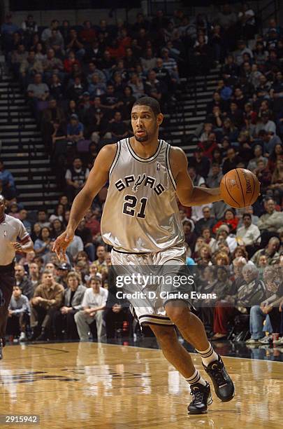 Tim Duncan of the San Antonio Spurs moves the ball during the game against the New Orleans Hornets at the SBC Center in San Antonio, Texas on January...