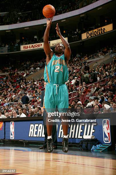 Jamal Mashburn of the New Orleans Hornets shoots for three against the defense of the Philadelphia 76ers January 30, 2004 at the Wachovia Center in...